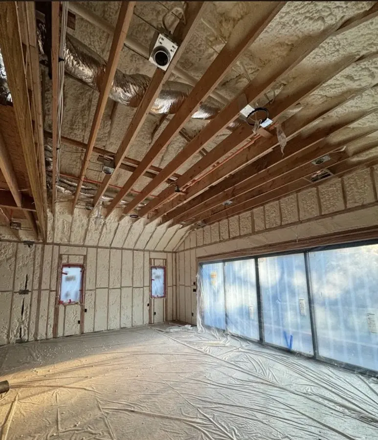 Interior walls and ceiling insulated with spray foam during new construction in Channahon